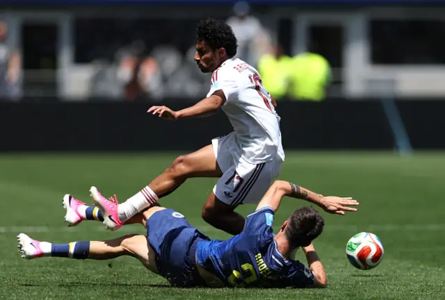 Ahmed Alganehi #17 of Qatar is tackled by Stjepan Radeljic