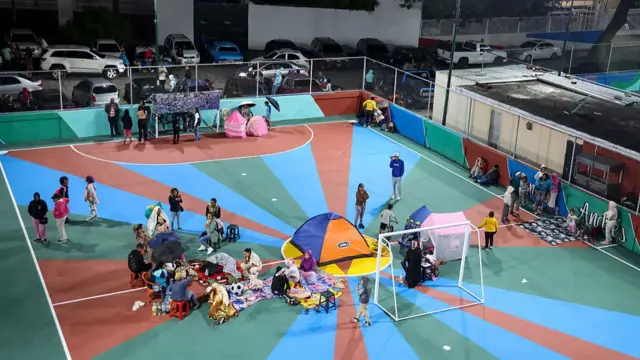 Caracas families set up tent on a football pitch following a series of earthquakes struck the country
