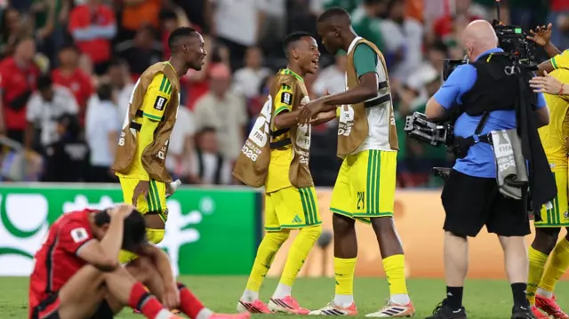 South Africa players celebrate after the 1-0 victory in the 2026 World Cup Group A football match between South Africa and South Korea.