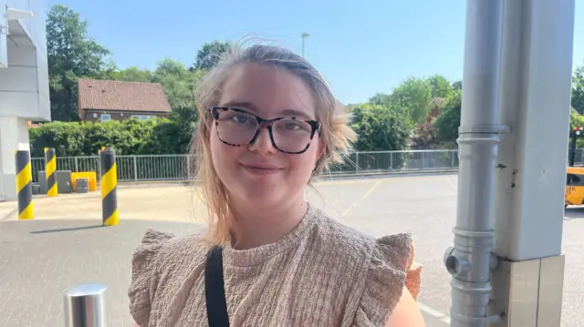 A woman in glasses.