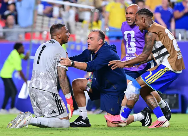 Curacao celebrate earning a draw against Ecuador