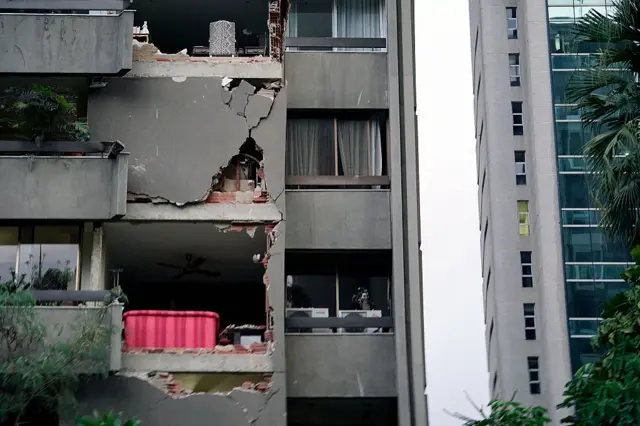 A damaged apartment building is seen following an earthquake in Caracas