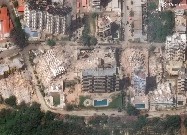 Vantor satellite image shows collapsed apartment buildings and widespread earthquake damage in the Playa Grande neighborhood of La Guaira