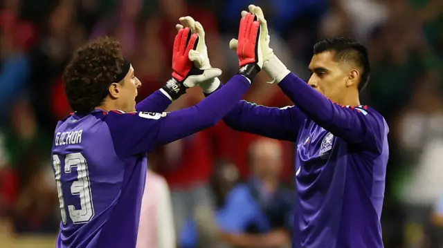 Guillermo Ochoa #13 of Mexico high fives with Raul Rangel #1 as he comes on as substitute during the FIFA World Cup 2026 Group A match between Czechia and Mexico.