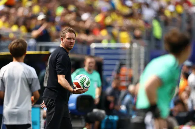 Germany's head coach Julian Nagelsmann holds the ball during