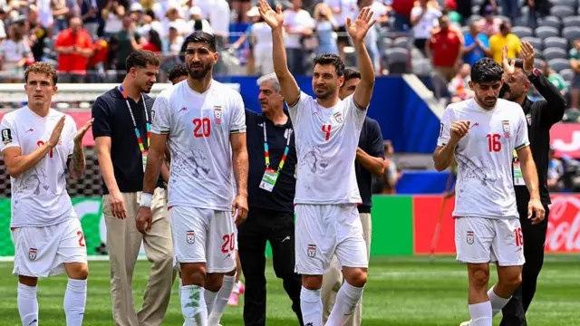 Iran players applaud their fans at the Los Angeles Stadium