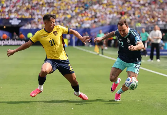 David Raum #22 of Germany controls the ball against Alan Franco