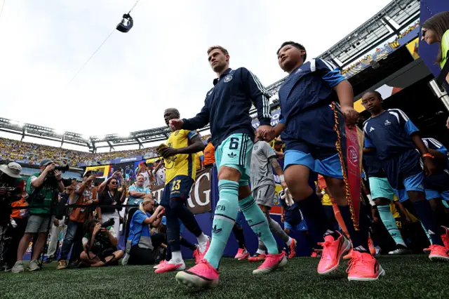 Moises Caicedo #23 of Ecuador and Joshua Kimmich