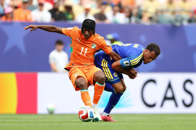 Yan Diomande #11 of Cote d'Ivoire controls the ball against Jurien Gaari