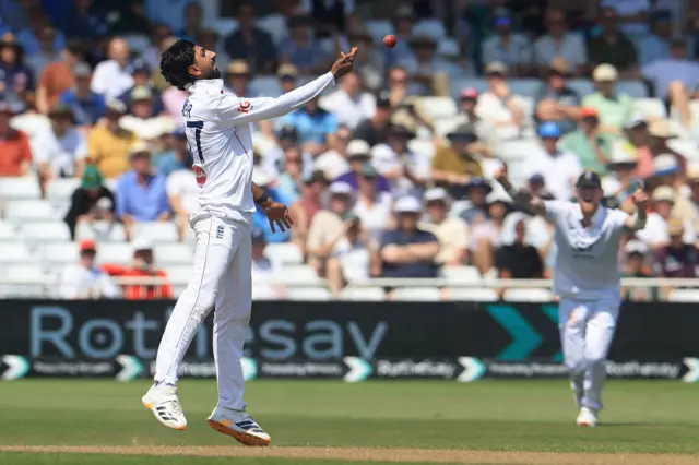 Bashir throws ball in air to celebrate the catch