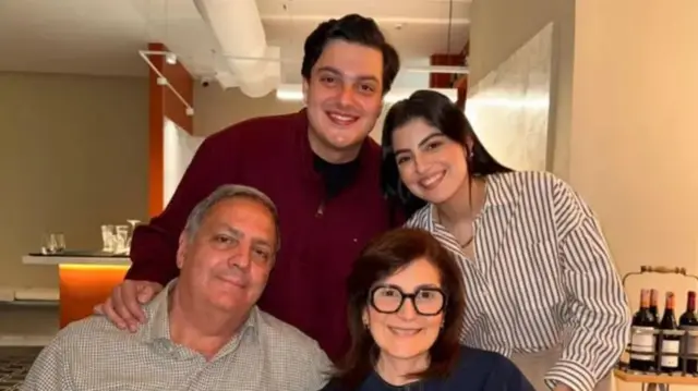 Marianella (top right) and Juan Diego (top left) with their parents at a family gathering