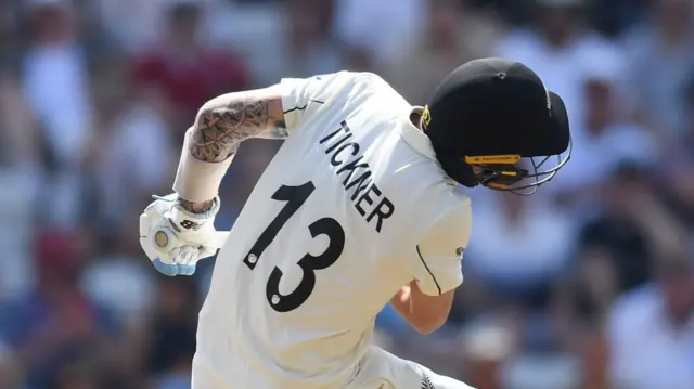 Blair Tickner leaning backwards after being struck by a bouncer