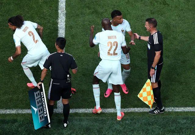 Kylian Mbappe #10 of France reacts with Jean-Philippe Mateta