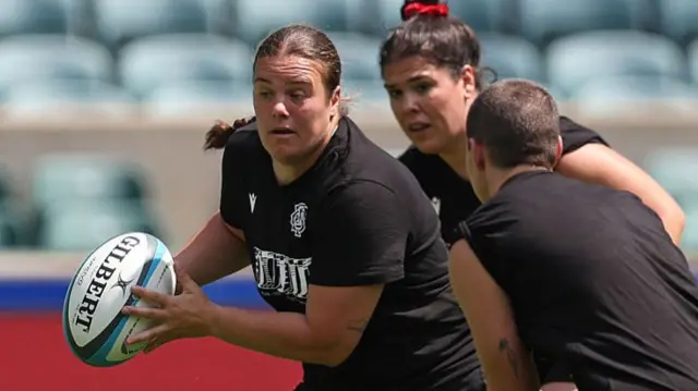 Carys Phillips runs with the ball in training for Barbarians