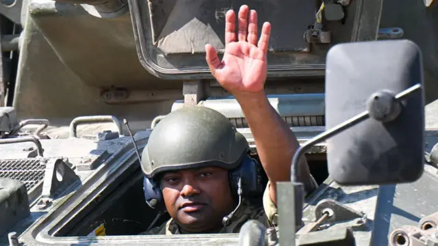 Johnson Beharry waves from tank