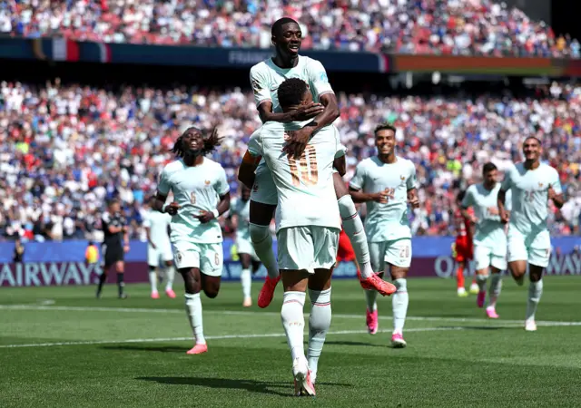 Ousmane Dembele #7 of France celebrates with Kylian Mbappe #10 after scoring the team's third goal