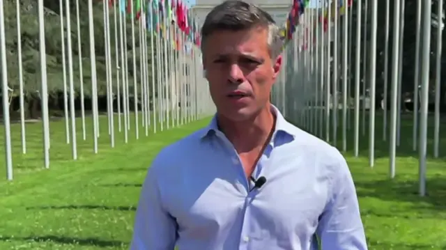 Leopoldo Lopez speaking on a patch of grass