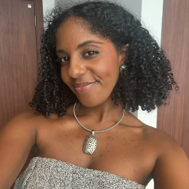 Sasha Wiltshire is smiling in a selfie she has taken and sent to the BBC