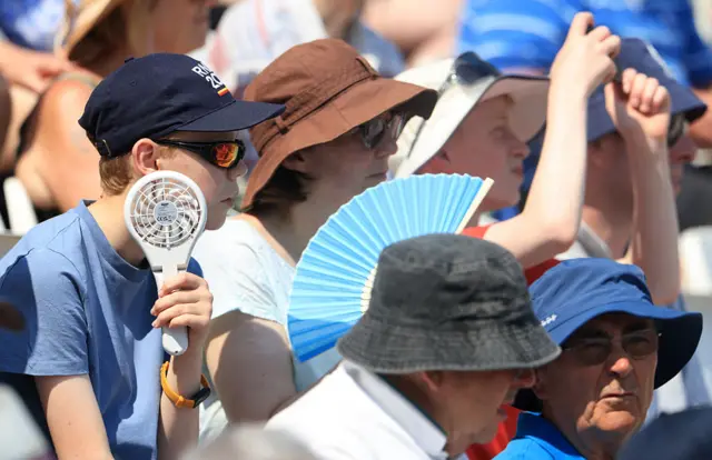 Crowd cooling themselves down at Trent bridge.