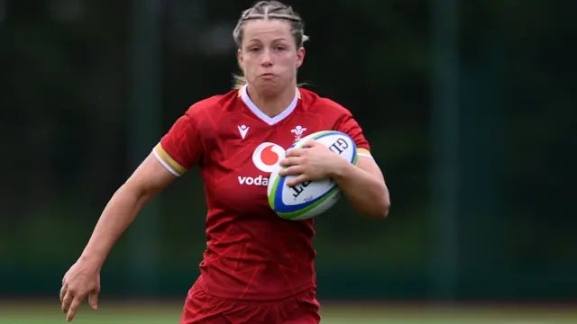 Amy Williams running with the ball for Wales Under-20s