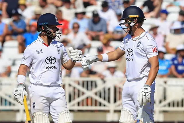 England's Ben Duckett and Jacob Bethell celebrate impressive partnership