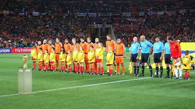 World Cup trophy and Netherlands team