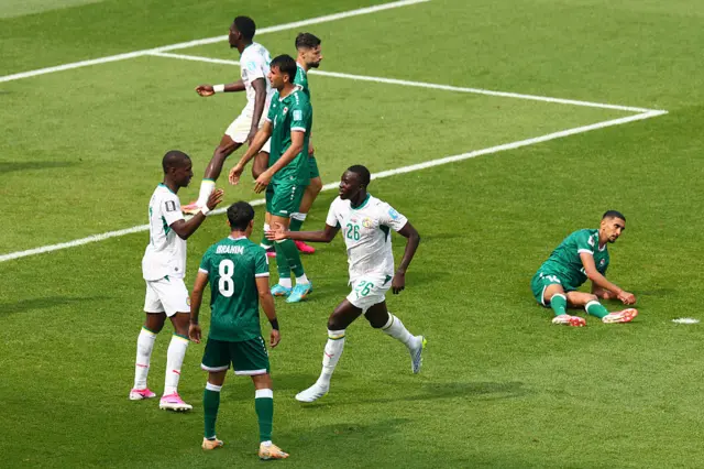 Pape Gueye #26 of Senegal celebrates with teammates after scoring his team's fourth goal