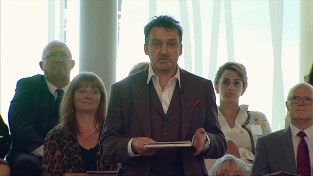Pàdraig MacAoidh [Peter Mackay] delivering a poem he wrote