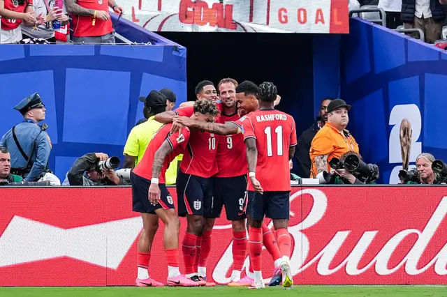 Jude Bellingham of England (2nd left) celebrates scoring the first team goal with Harry Kane