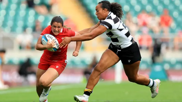 Kayleigh Powell runs at Barbarians defence