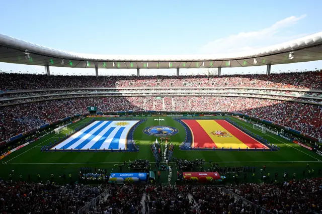 Players enter the pitch ahead of the 2026 World Cup Group H football match between Uruguay and Spain at the Guadalajara Stadium