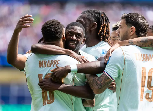 Ousmane Dembele and Kylian Mbappe celebrate