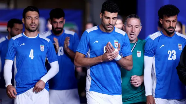 Shoja Khalilzadeh #4, Mehdi Taremi #9 and Ramin Rezaeian #23 of IR Iran prepare to warm up before the FIFA World Cup 2026 Group G match between Egypt and IR Iran