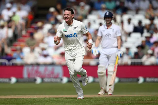 Nathan Smith celebrating dismissing Jamie Smith