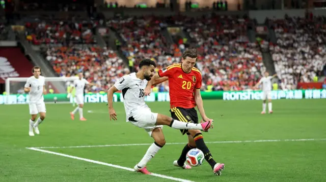 Sarpreet Singh of New Zealand is challenged by Hans Vanaken