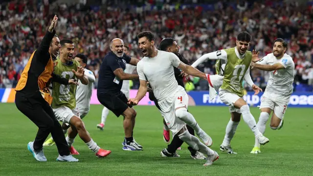 Shoja Khalilzadeh celebrates scoring