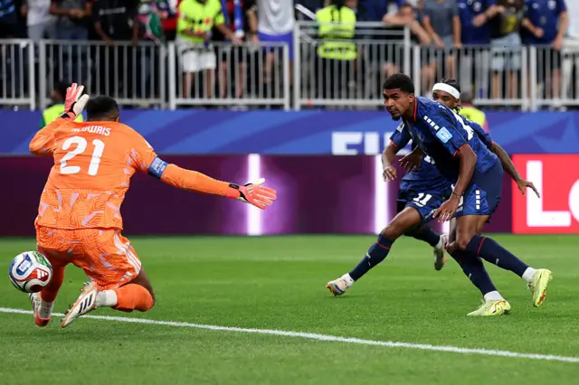 Laros Duarte #15 of Cabo Verde shoots and misses a chance against Mohammed Al-Owais