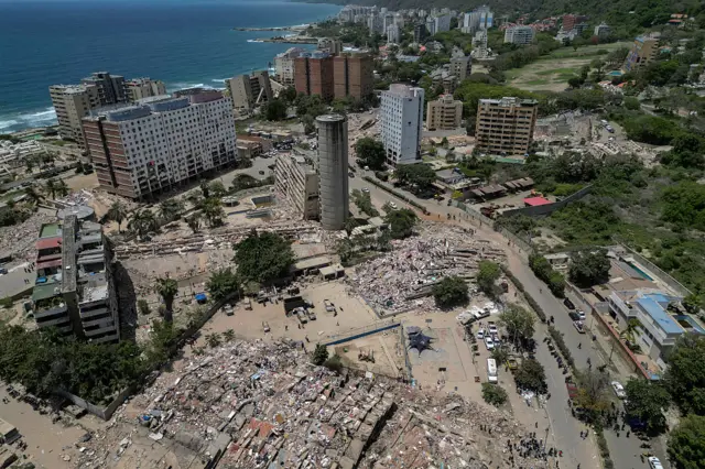 This aerial view shows rescuers and volunteers working amid the rubble of collapsed buildings in Caraballeda, La Guaira state, Venezuela