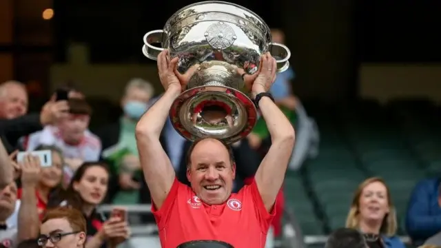 Feargal Logan lifts the Sam Maguire Cup in 2021