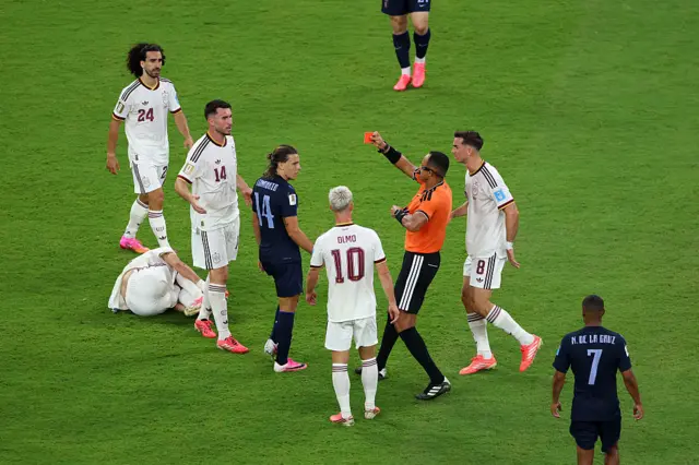 Agustin Canobbio #14 of Uruguay receives a red card
