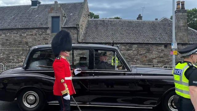 The Crown Of Scotland arrives at the Scottish Parliament