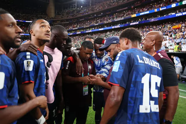 Cabo Verde players and staff await the result between Spain and Uruguay coming through on phones after the FIFA World Cup 2026 Group H match between Cabo Verde and Saudi Arabia at Houston Stadium on June 26, 2026 in Houston, Texas
