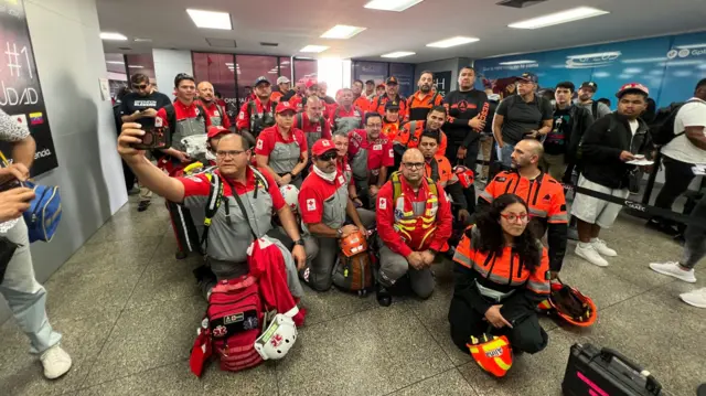 Rescuers pictured at the airport