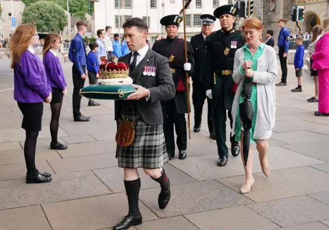 The Duke of Hamilton carries the Crown of Scotland ahead of the opening of the seventh session of the Scottish Parliament in Edinburgh