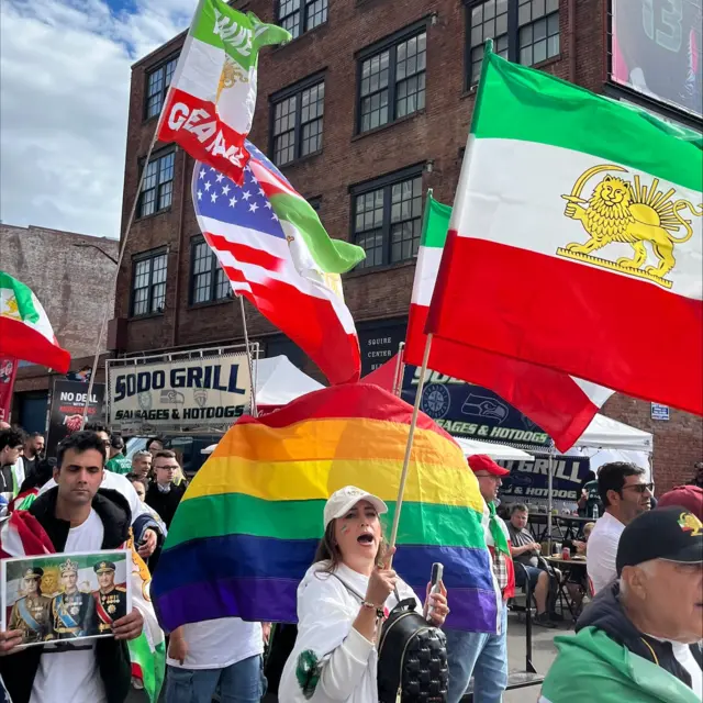 Iran fans wave before the match