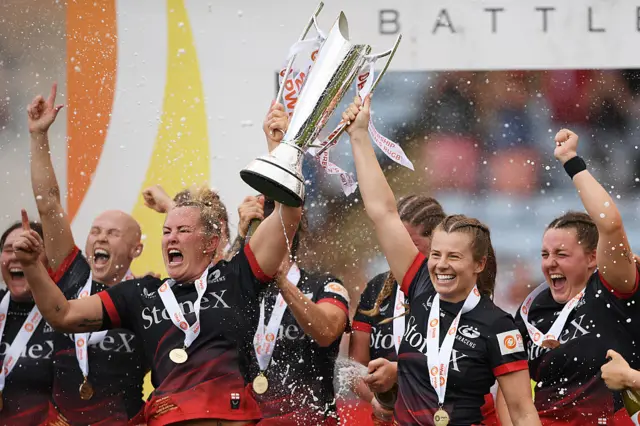 Packer and Harrison lift the trophy