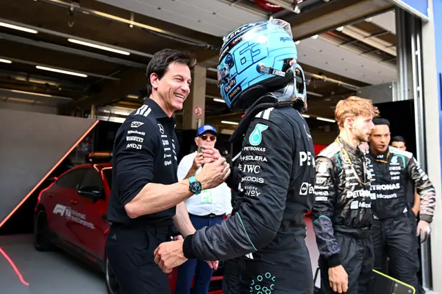 Mercedes team boss Toto Wolff celebrates with race winner George Russell at the 2026 Austrian Grand Prix