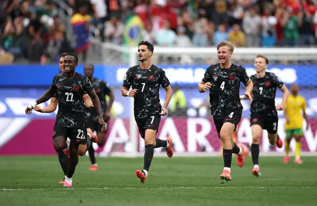 Stephen Eustaquio and Canada's players celebrate