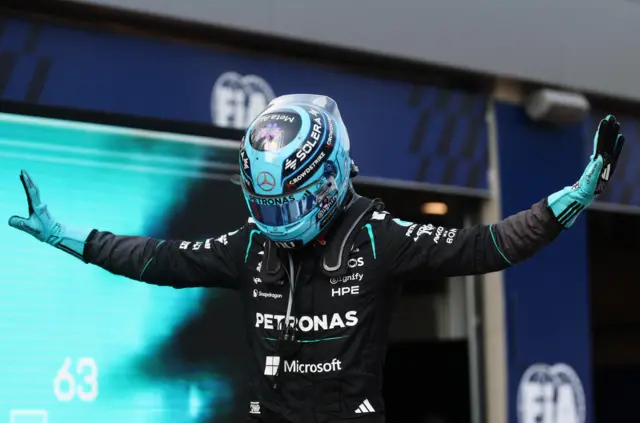 George Russell does his T pose after winning in Austria