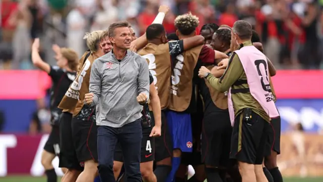 Jesse Marsch, Head Coach of Canada, celebrates after his side's first goal scored by Stephen Eustaquio #7 of Canada (obscured) during the FIFA World Cup 2026 Round Of 32 match between South Africa and Canada.
